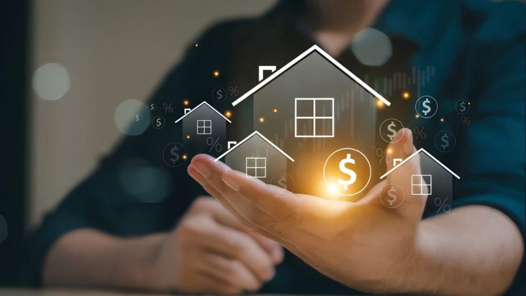 Hands cupping glowing houses and dollar symbols, symbolizing real estate investment and financing